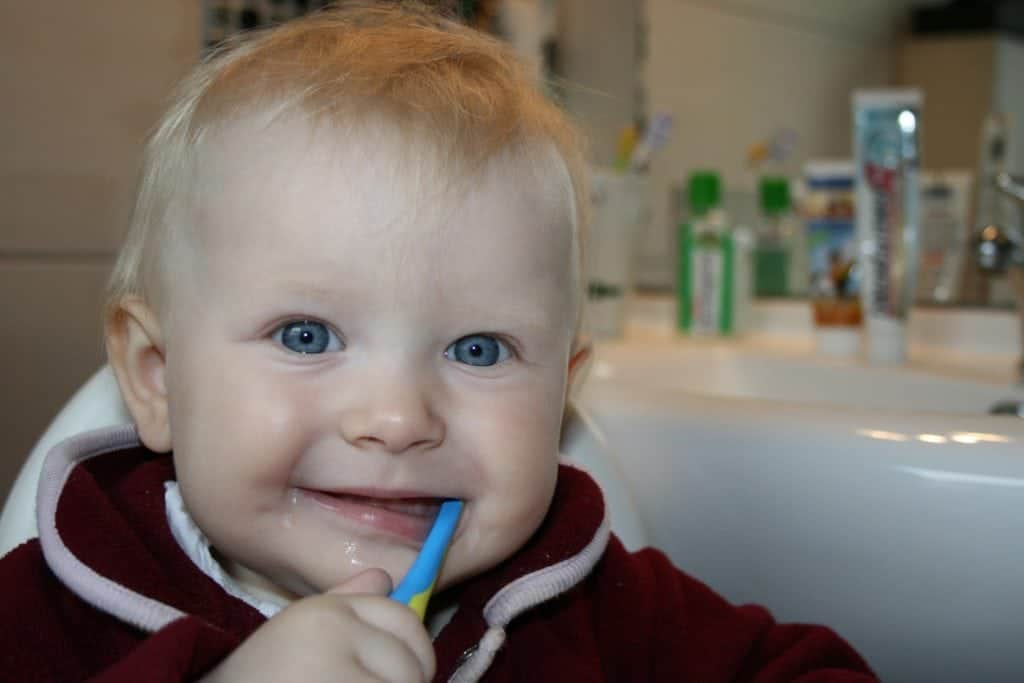 Child brushing teeth