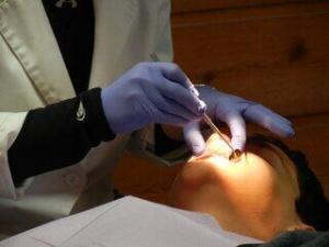 dentist with patient in chair